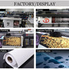 Factory display of abstract coffee wall art canvas prints and fabric samples.