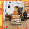 A rustic wooden maple leaf tiered tray set featuring pumpkins, spices, and leaves on a light wood surface.