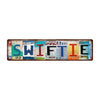 Vintage metal tin sign with the word SWIFTIE painted in various colors and text.