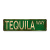 Vintage metal sign with green background and gold lettering that reads TEQUILA WAY