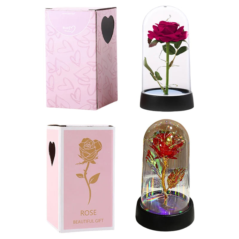 A pink rose in a glass dome with an LED light, presented in packaging.