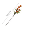 A sprig of artificial chrysanthemum pompon flowers with orange-brown blooms on a thin stem.