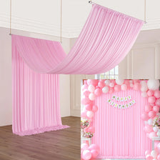 Pink pleated curtain backdrop for parties and photography with pink balloons