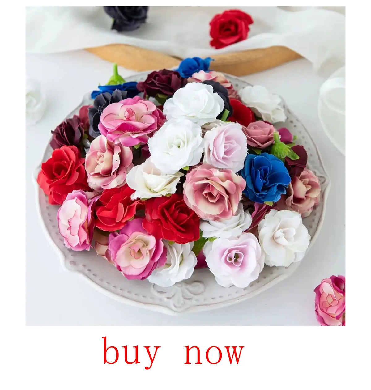 A platter of realistic silk rose flowers in various shades of pink, red, white, and blue.