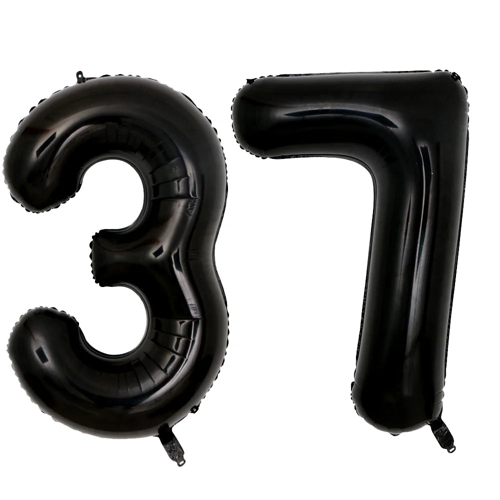 A set of two giant black foil balloons shaped like the number 37