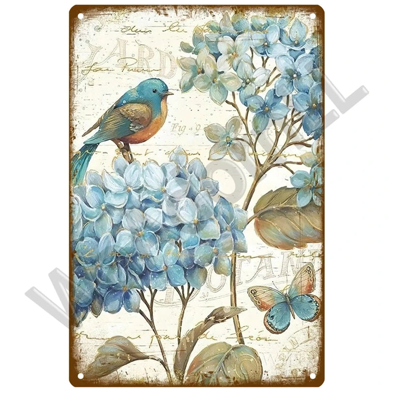 Vintage metal sign featuring a watercolor illustration of blue flowers and a butterfly on a rustic background.