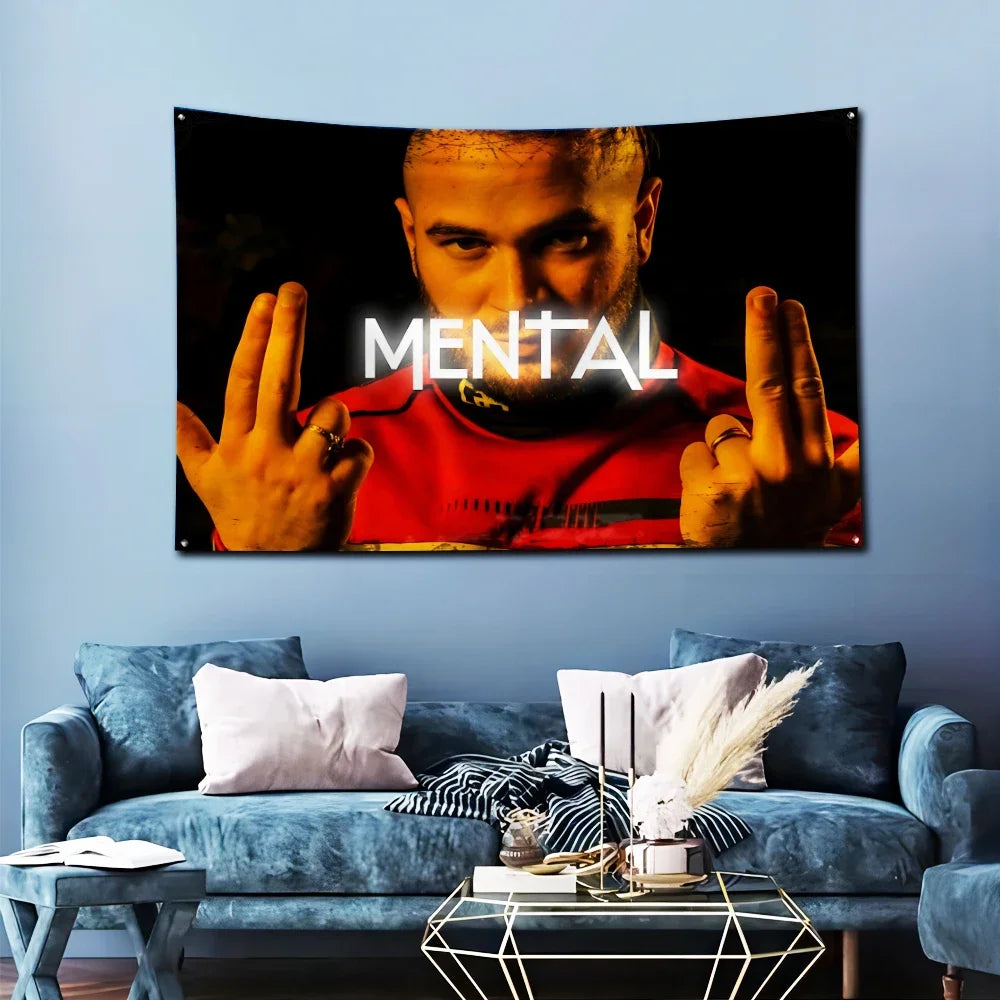 A banner featuring a man's face with glowing text and a red background displayed on a wall.