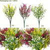 Three artificial lavender stems showing vibrant pink, purple, and yellow blooms on green foliage.