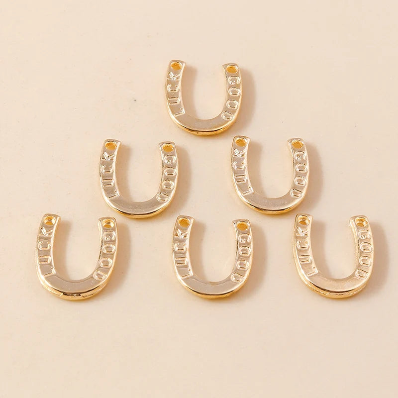 A collection of gold horse charm pendants for handmade jewelry displayed on a light background.