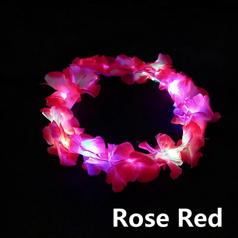 A glowing rose red LED flower crown headband against a black background.