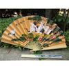 A large decorative Chinese theme wall fan with a light wood frame and painted scenes of birds and foliage.