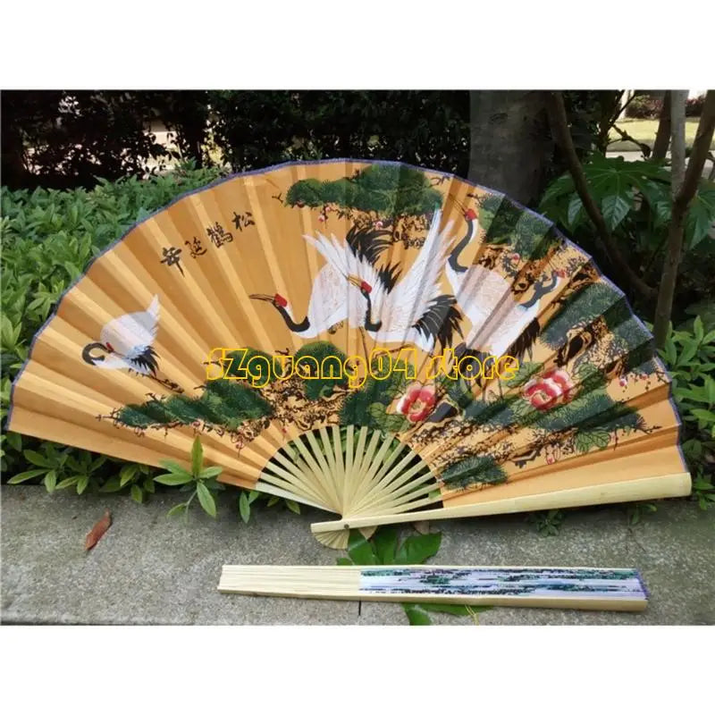 A large decorative Chinese theme wall fan with a light wood frame and painted scenes of birds and foliage.