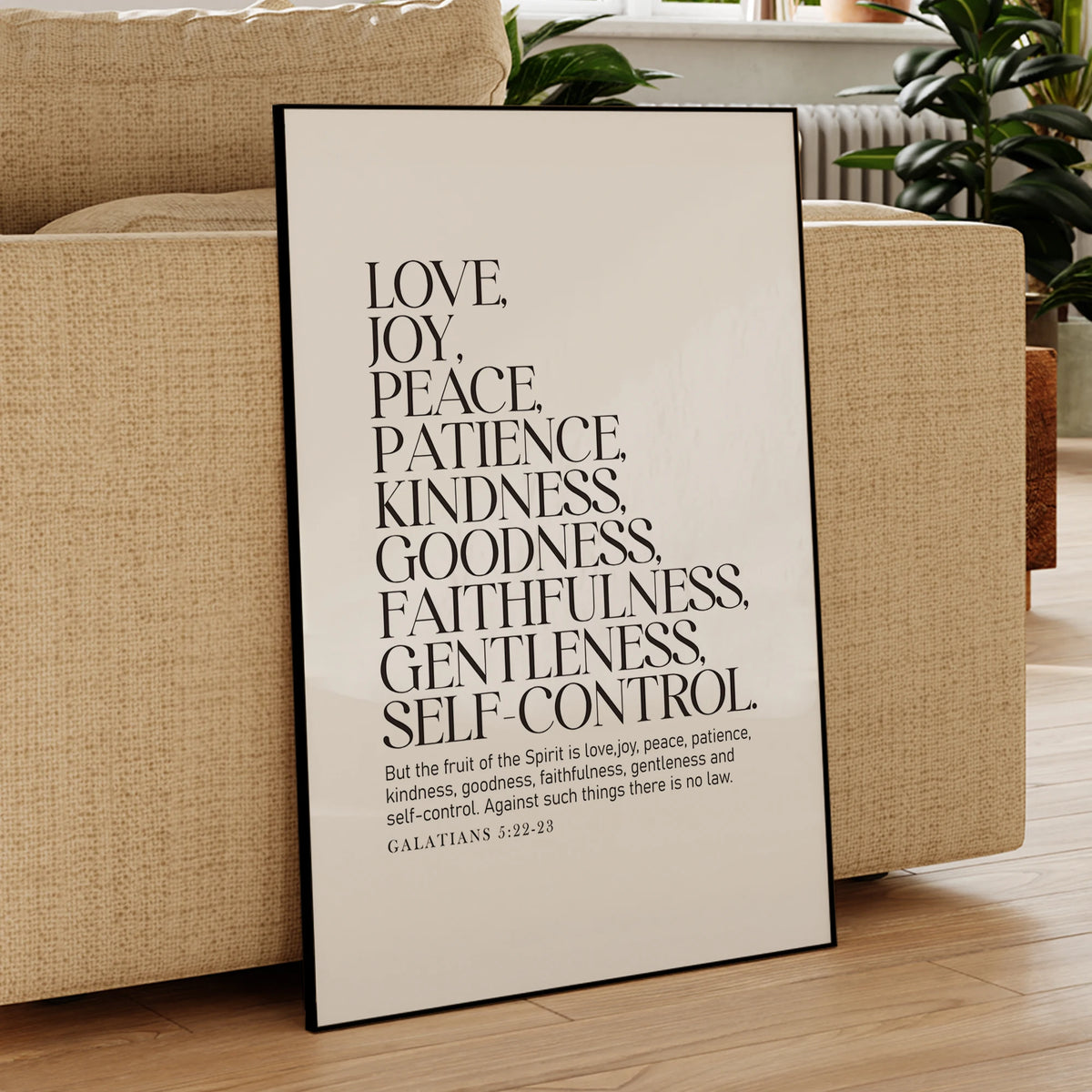 A framed canvas print displaying a list of virtues from Galatians 5:22-23 on a neutral background.
