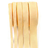 A roll of yellow and white gingham ribbon used for gift wrapping, crafts, or party decor.