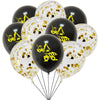 A bunch of black and white latex balloons decorated with yellow construction equipment silhouettes