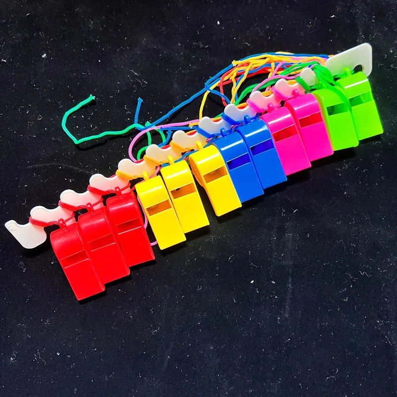 A colorful plastic whistle set with various colored whistles attached to lanyards.
