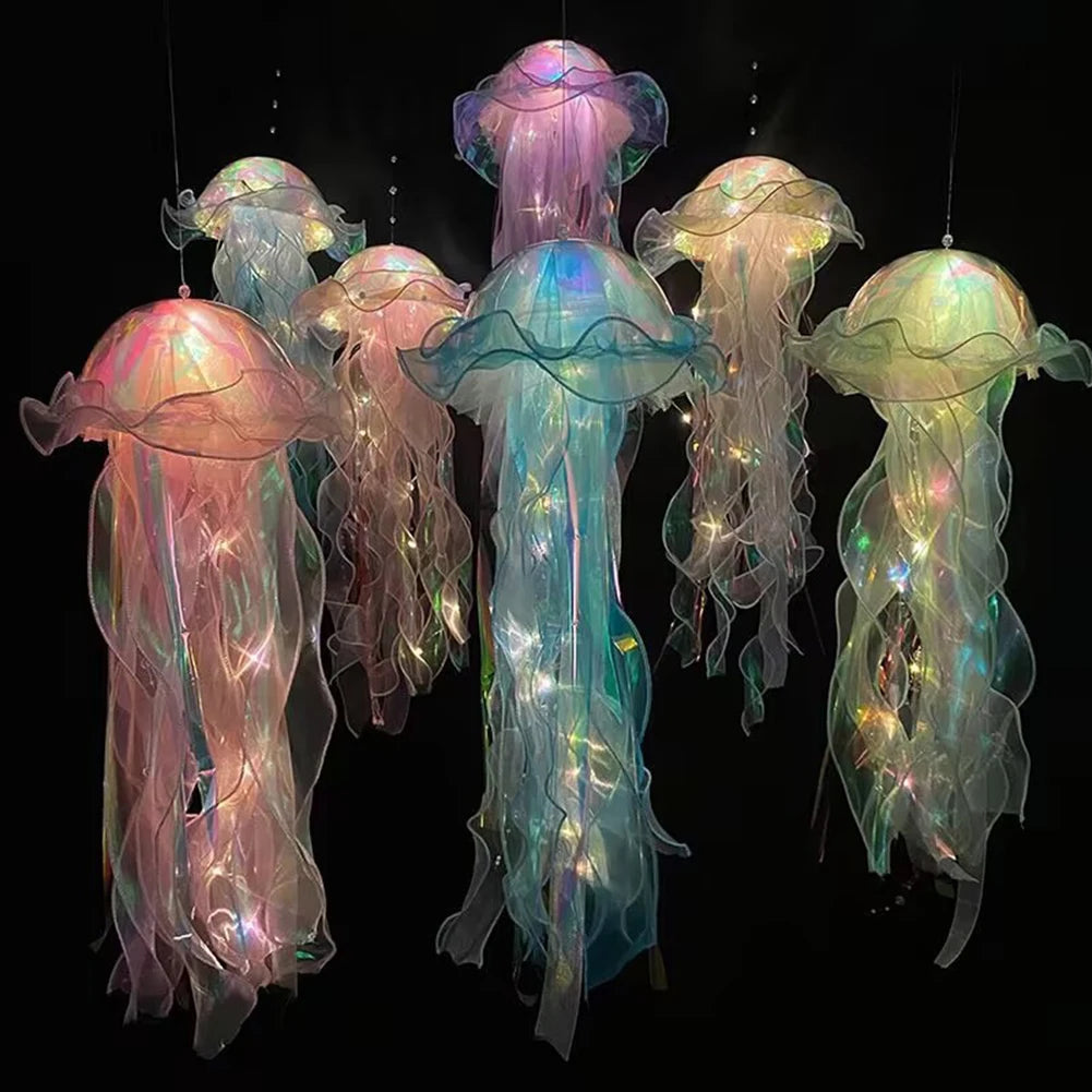 A collection of glowing jellyfish lanterns in shades of pink, purple, and teal suspended against a dark background.