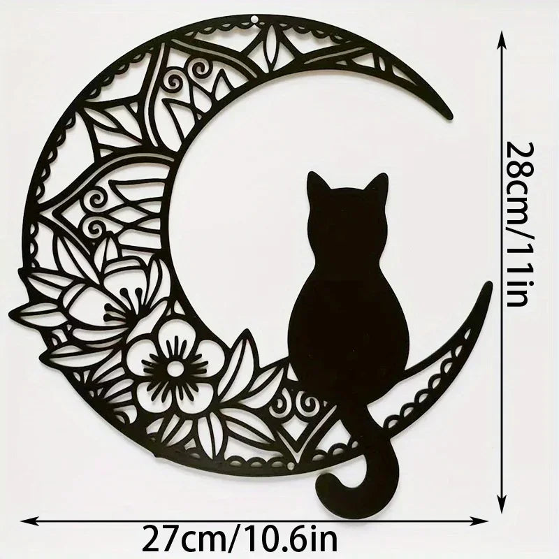 Black silhouette of a cat sitting on a crescent moon cutout wall decor