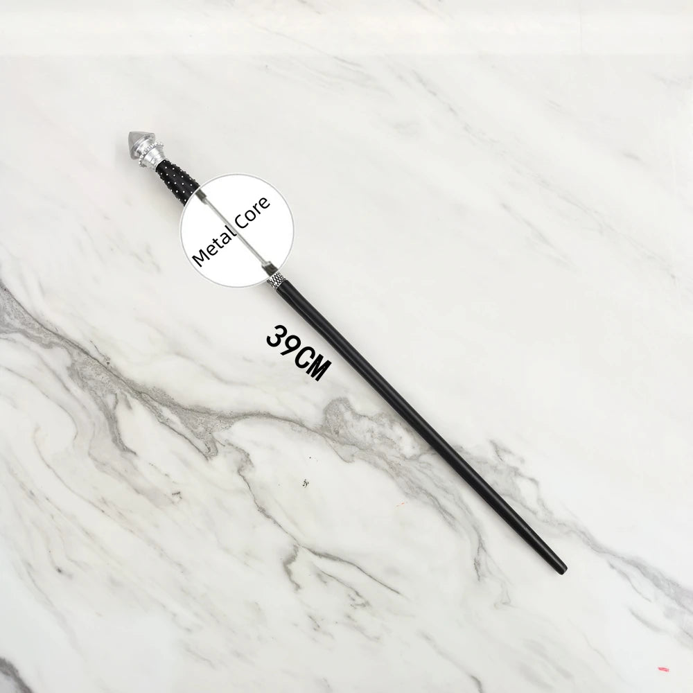 A black metal magic wand replica with a silver tip and a circular label marked Metal Core displayed on a white marble surface