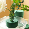 Round green floral foam blocks used for making fresh and artificial flower arrangements.
