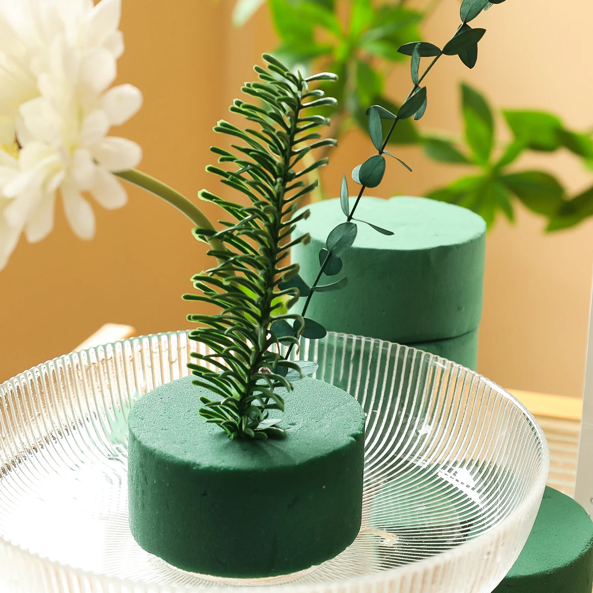 Round green floral foam blocks used for making fresh and artificial flower arrangements.