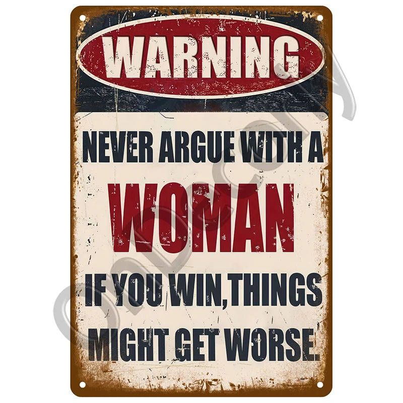 A vintage metal sign with a warning about not arguing with a woman and the consequences of winning.