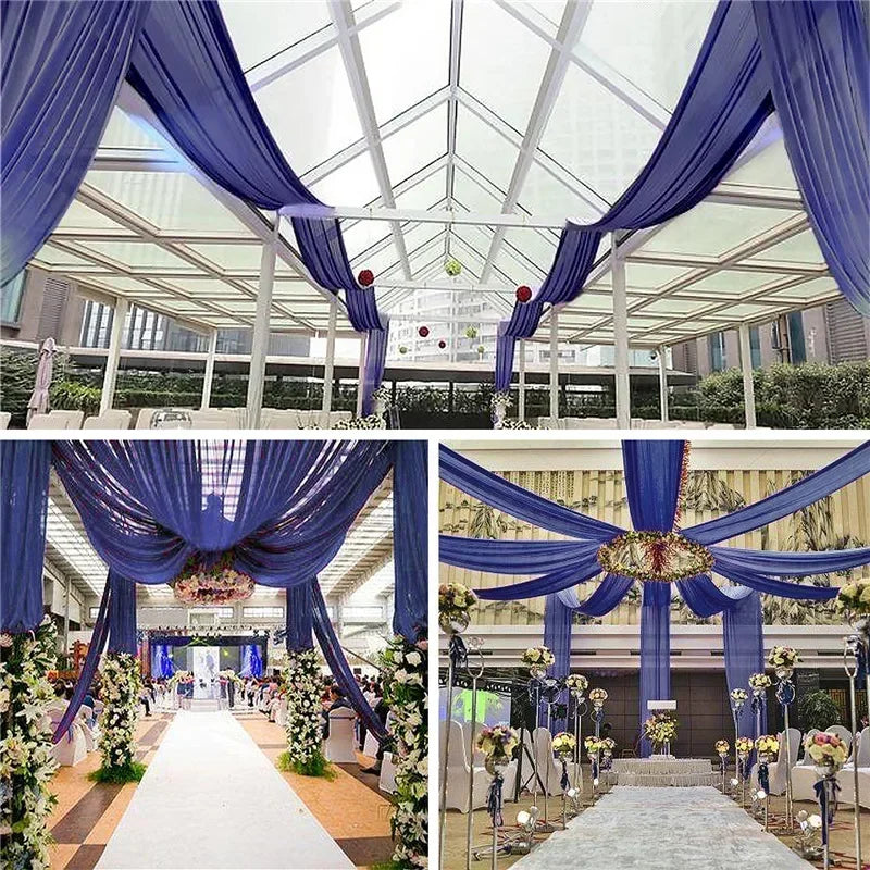 Blue sheer chiffon curtains draped across a glass ceiling for an indoor event or wedding venue.