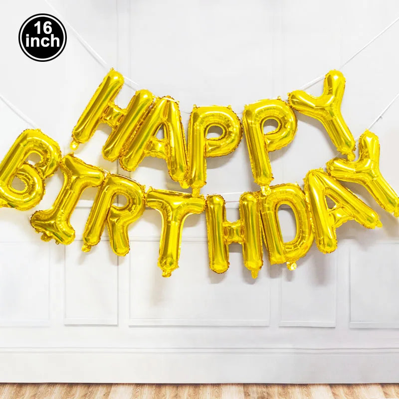 A golden foil balloon decoration set spelling out Happy Birthday mounted on a white door.