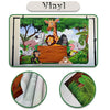 A green vinyl porch banner featuring jungle animals and a wooden sign with Mexican motifs.