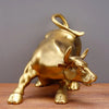 A golden sculpture of a bull head and body, designed for home decor.
