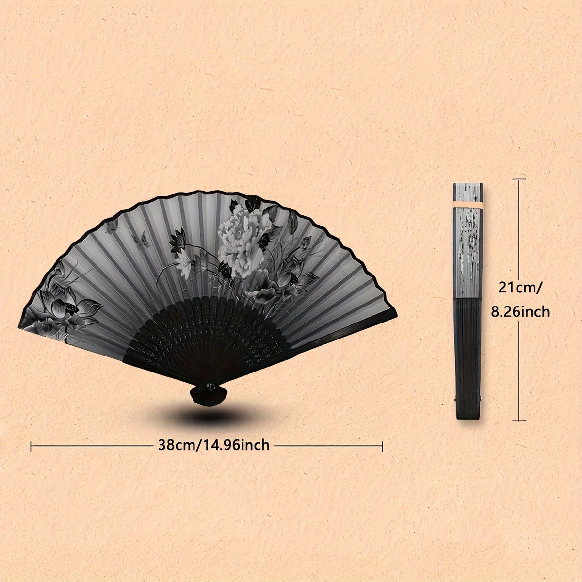 A black hand folding fan with floral patterns shown open and closed, next to a measuring stick.