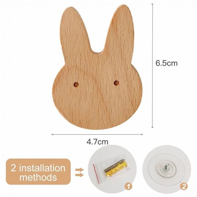 A light wood decorative animal hook with two installation methods shown.
