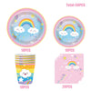 A set of disposable paper plates, cups, and napkins featuring a rainbow cloud design for parties.