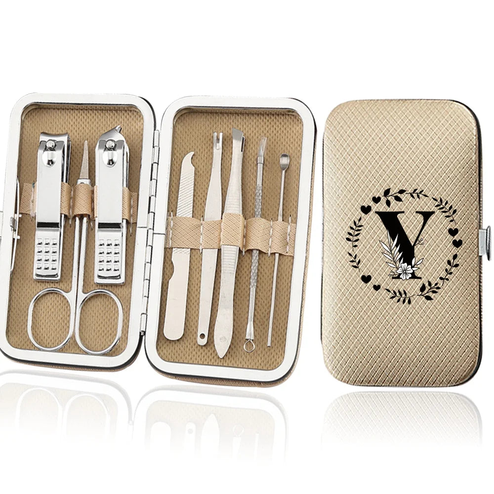 An open leather case displaying an 8-piece stainless steel manicure and pedicure kit with various tools.