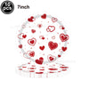 A set of ten red heart letter balloons with a foil finish displayed on a white plate.