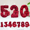 Red glitter bow number candles spelling 520 and 1346789 for birthday celebrations