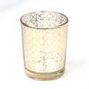 Elegant glass votive candle holder with a textured, faceted design.