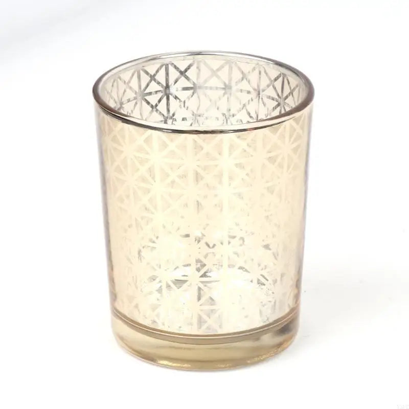 Elegant glass votive candle holder with a textured, faceted design.