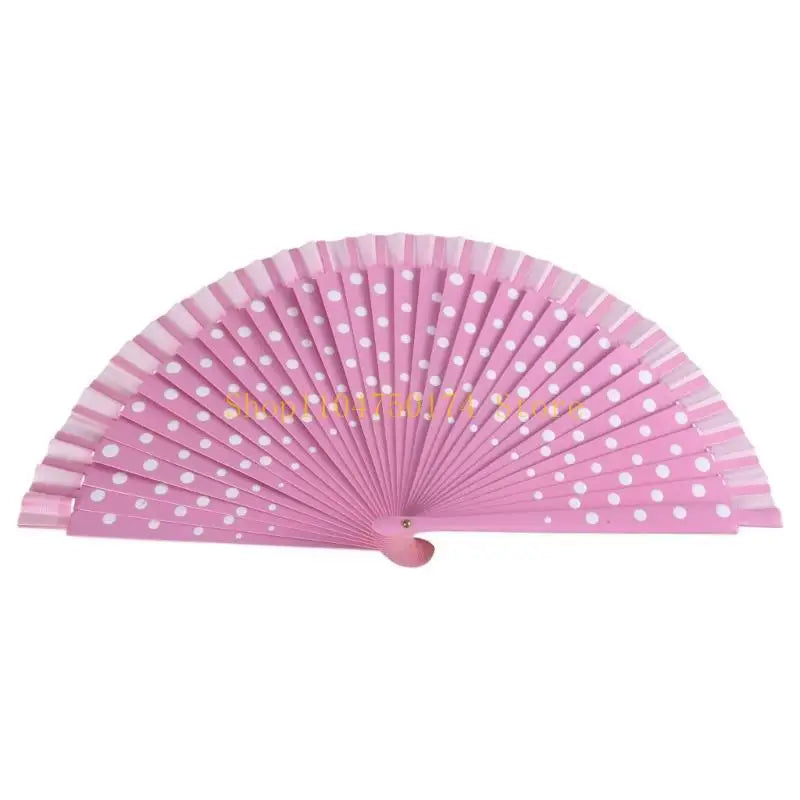 A pink wooden hand fan with numerous small holes, designed for dance and parties.
