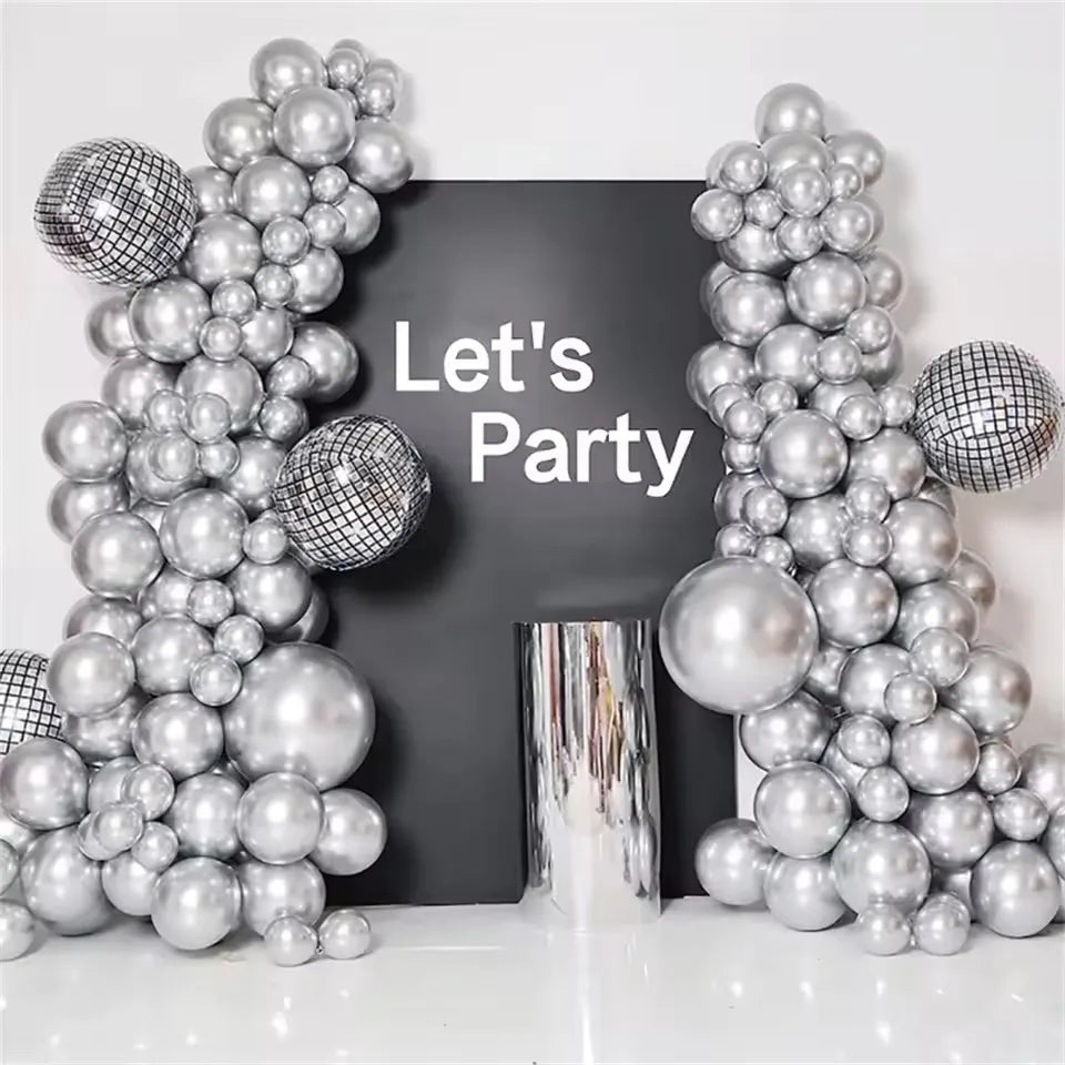 A silver metallic balloon garland arch kit featuring round and disco ball-like balloons displayed against a dark background.