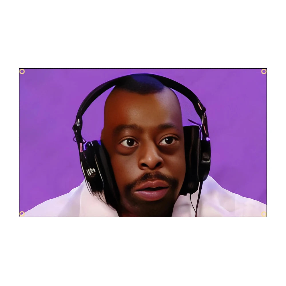 A man wearing large black headphones is looking directly at the camera against a purple background.