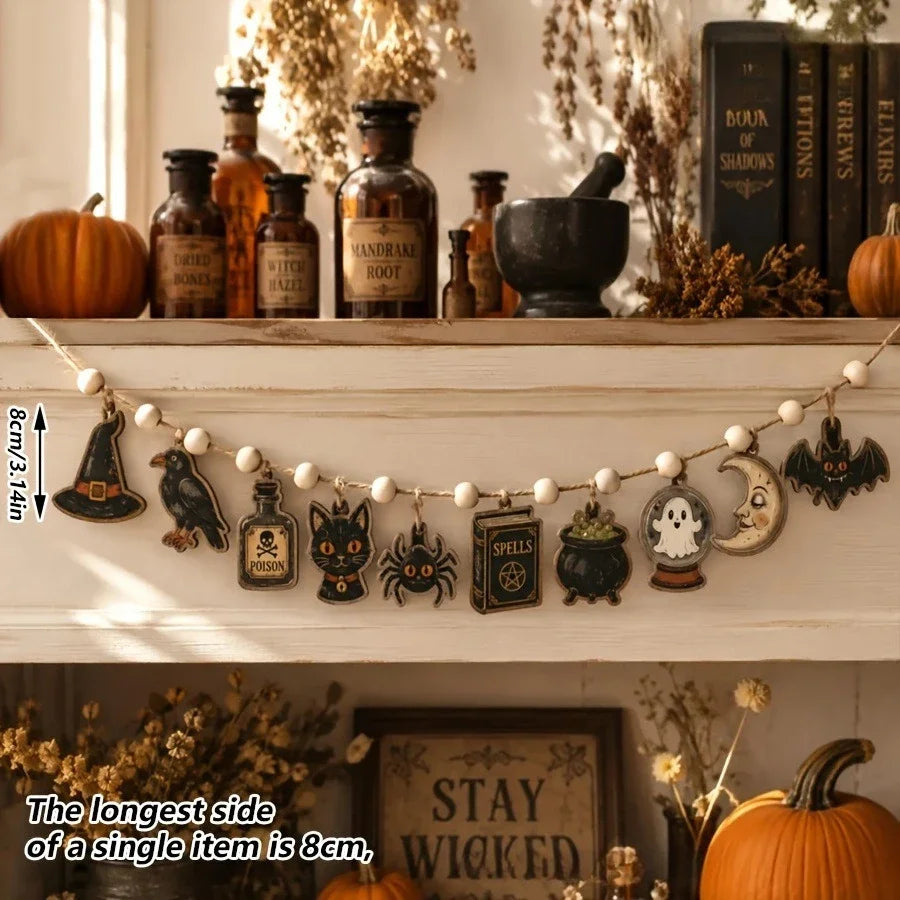 Vintage Halloween wooden hanging garland featuring retro pumpkin, ghost, and cat beads displayed on a shelf.