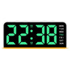 A digital alarm clock displaying 22:38 with a green LED display and surrounding text for days of the week.