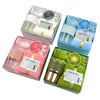 A gift set containing a tumbler, towel, and UPF sun protection in various colors and packaging.