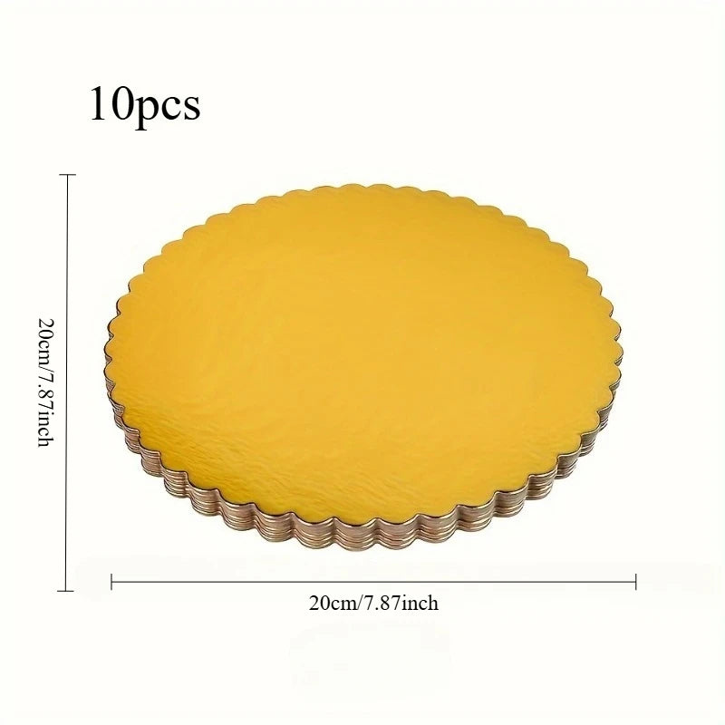 A set of ten round yellow disposable cake plates with a scalloped edge.