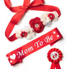 Red satin ribbon with white and red floral accents for a maternity sash and corsage pin set