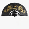 Black traditional bamboo folding fan decorated with gold dragons and a yin-yang symbol.