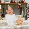 A light pink silicone candle mold shaped like a gnome with a honeycomb hat sitting on a white pedestal.