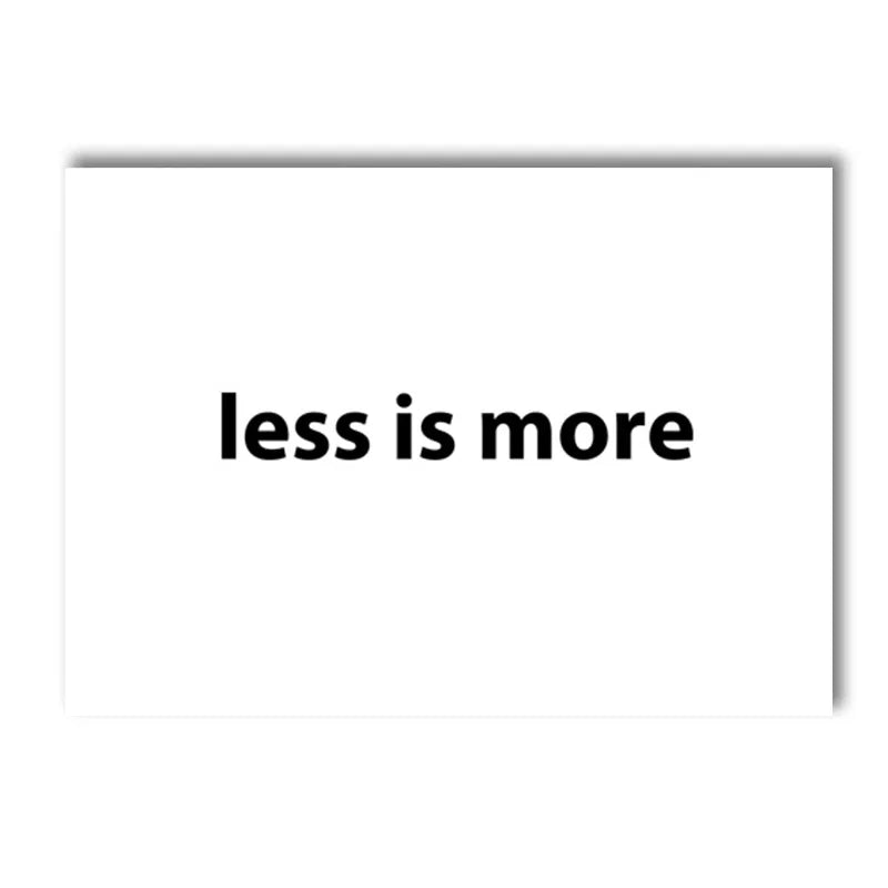 A white canvas art print featuring the motivational quote less is more in black text.