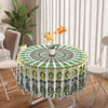 Bohemian peacock mandala round tablecloth with green and yellow patterns on a table.